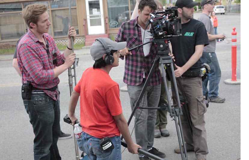 Students work with  industry professionals onset in Downtown Fairbanks on the set of "Feels Good" during the 2014 Film Reel Alaska Mentor Experience program.
