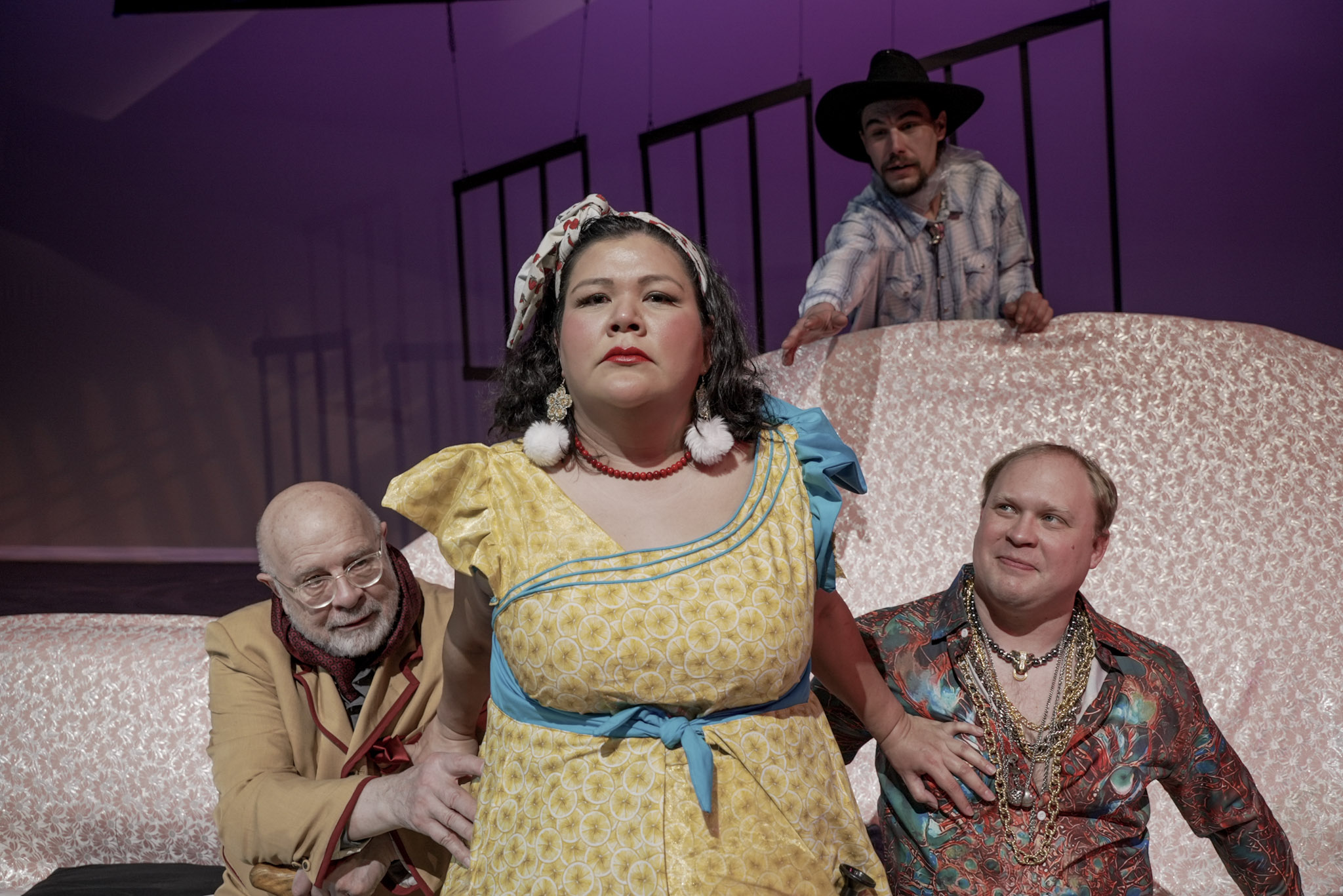 Publicity photo from Something in the Living Room. Donetta Tritt as Cora Alice Jane pushes herself forward as The Professor (Hank Nuwer) and Cowboy (Skylar Ray Benson Davis) reach towards her. FatCat (Tim Ott) watches her with a smile. Photo by the Department of UAF Theatre & Film 