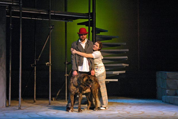 When an embrace catches you off guard: arms by his side, holding his loyal companion's leash, as an awkward hug ensues.