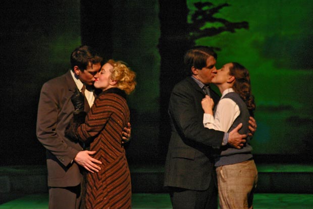 In the spotlight's glow, two couples share intimate moments, captured in a tender close-up