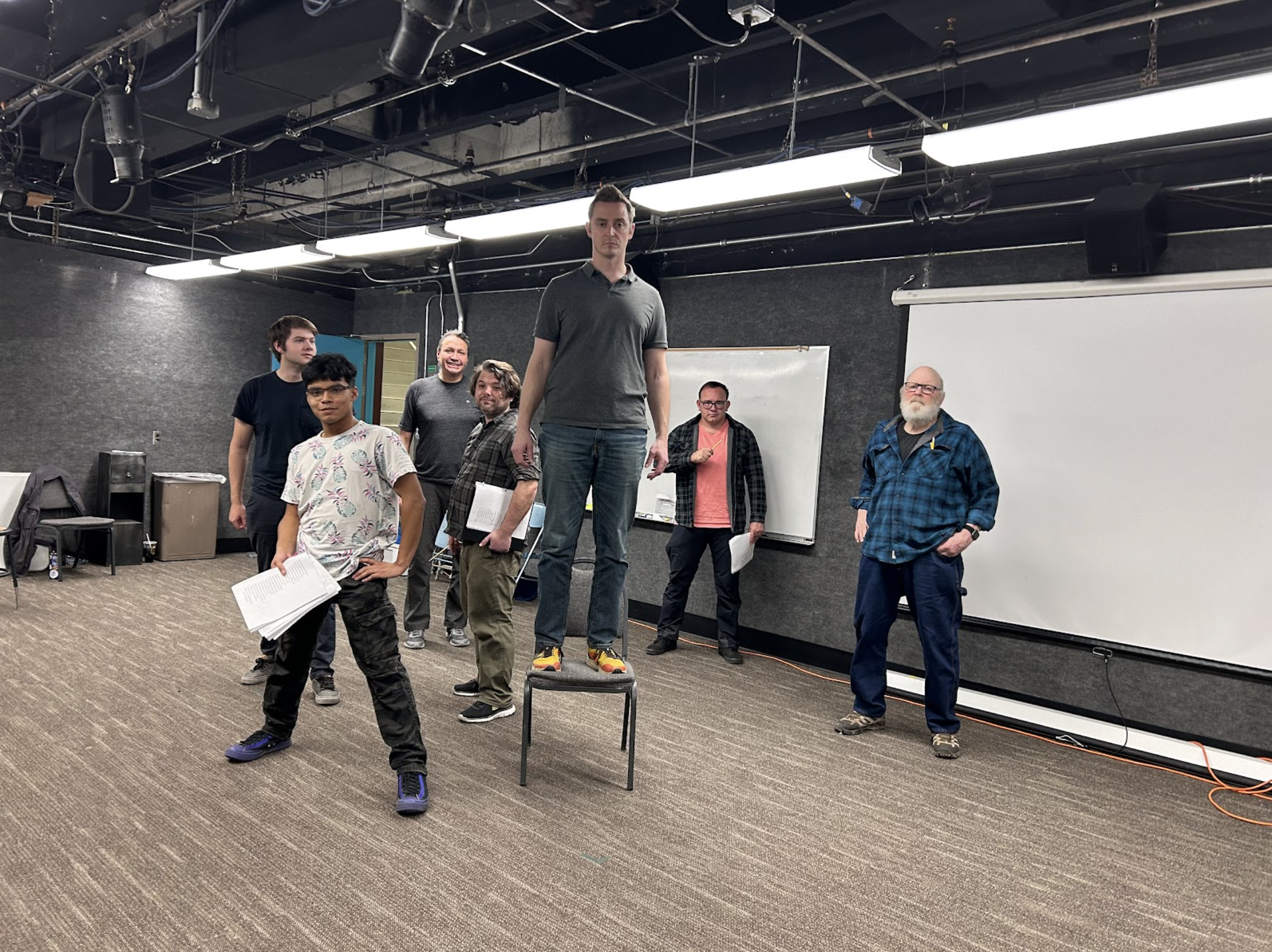 “May we cram within this wooden O the very casques that did affront the air at Agincore?” “May we cram within this wooden O the very casques that did affront the air at Agincore?” Use your imagination to see actors Logan Ehrhart, Tim Hall, Don Crowe, John DiCandeloro, Levi Ben-Israel, Matt Herrera, and Bruce Hanson holding swords, just about to charge into battle against the French. Photo by Kade Mendelowitz, Theatre UAF