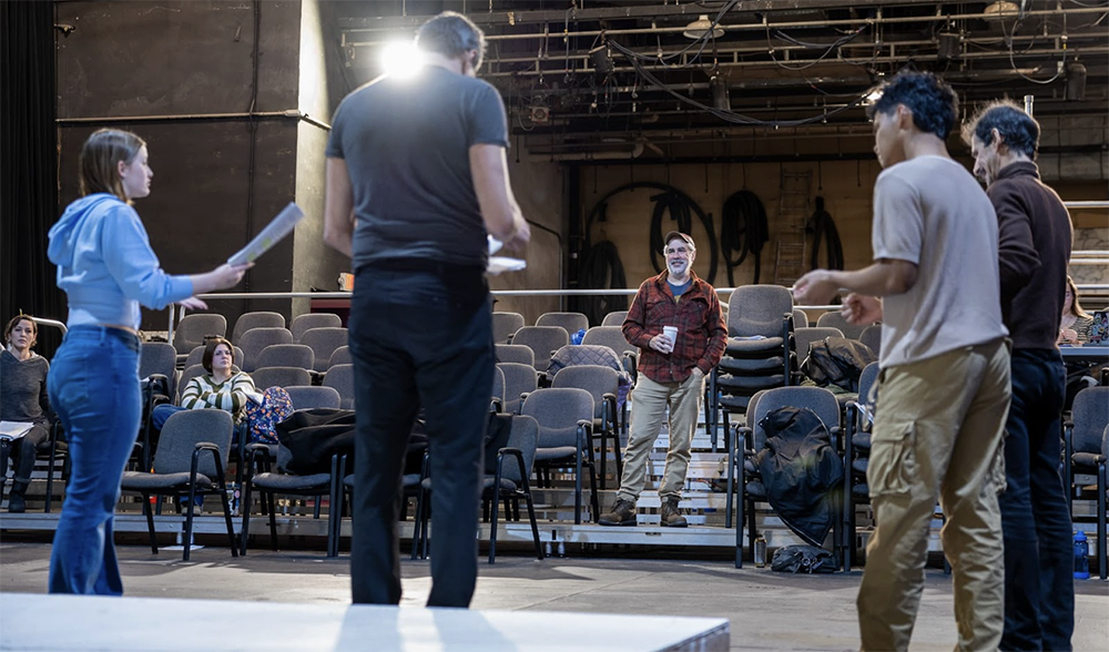 Director Tom Robenolt (Center) watches actors Emily Cooley, Don Crowe, Tim Hall, and Nicholas Glovin rehearse a scene from Comedy of Errors. Photo credit: Kade Mendelowitz