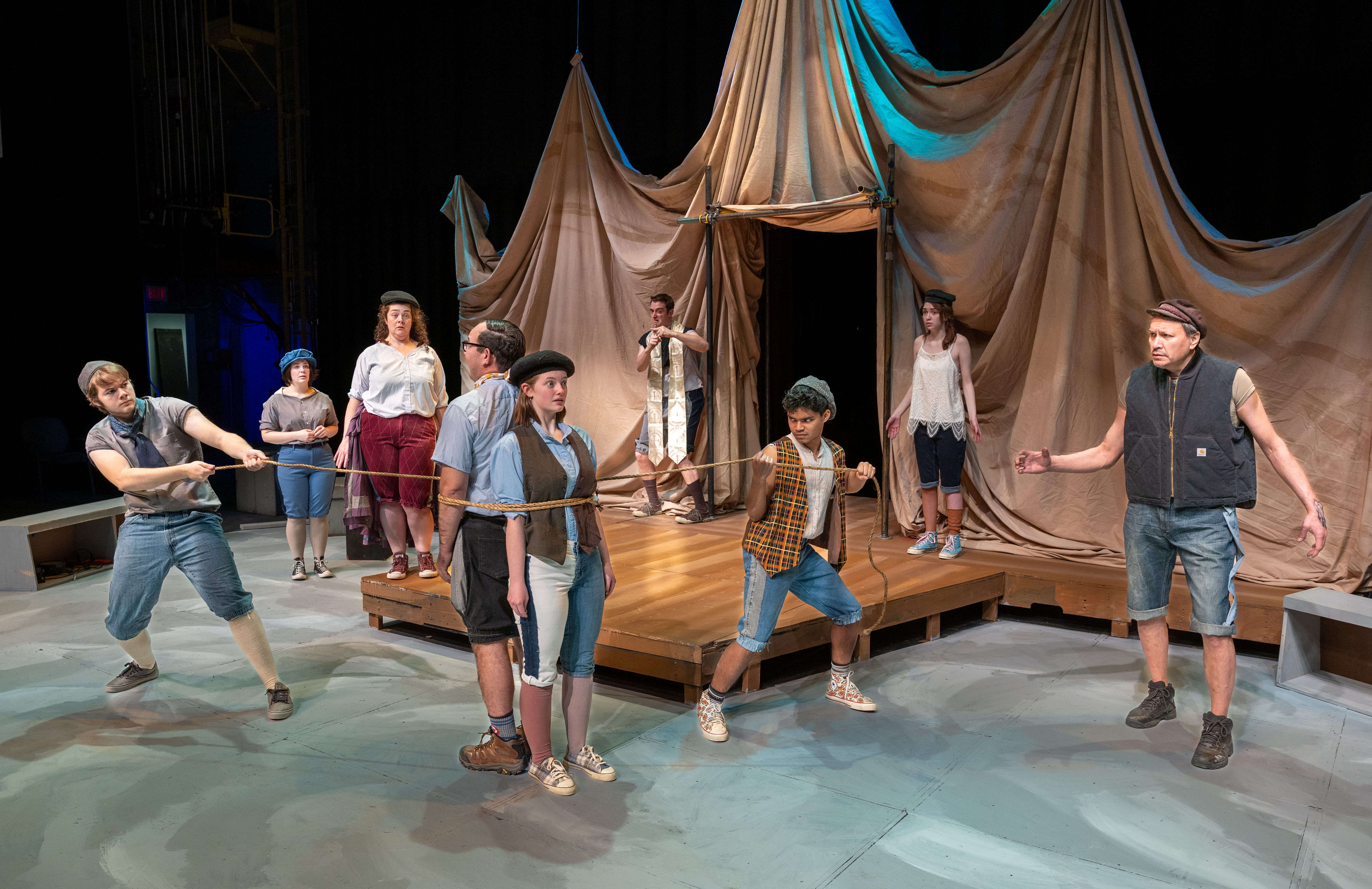 “Dr. Pinch ties up Antipholus of Ephesus and Dromio of Ephesus” (Left-right): Logan Ehrhart, Kaylee Cole, Rachel Blackwell, Matthew Herrera, Emily Cooley, Levi Ben-Israel, Tim Hall, Daisy Massey and Don Crowe. From “Comedy of Errors”, part of Theatre UAF’s production of “Historical Comical: A Shakespeare Double Bill” directed by Tom Robenolt running November 7-16, 2025. https://www.uaf.edu/theatrefilm/ Photo by Kade Mendelowitz, Theatre UAF