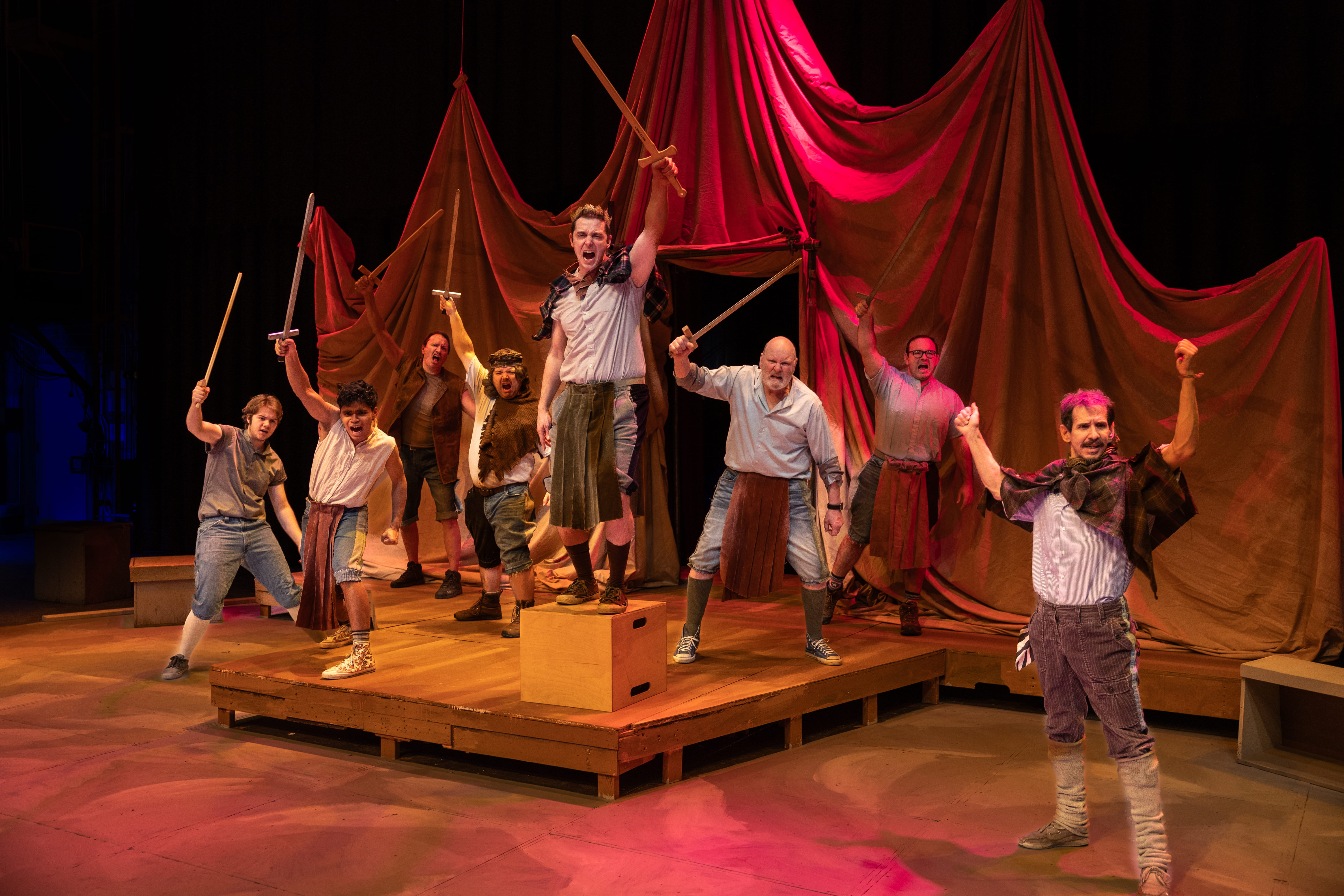 Left-right: Logan Ehrhart, Tim Hall, Tim Hall, Don Crowe, John DiCandeloro, Levi Ben-Israel, Bruce Hanson, Matthew Herrera, and Nicholas Glovin. From “Henry V”. Photo credit: Kade Mendelowitz, Theatre UAF