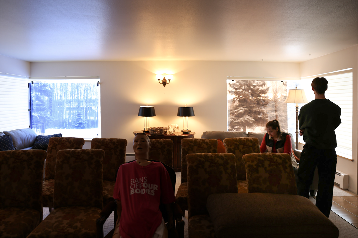 Strange Embrace BTS Two members of the Strange Embrace cast and crew prepare for shooting on the set of Strange Embrace. UAF Photo by Maya Salganek