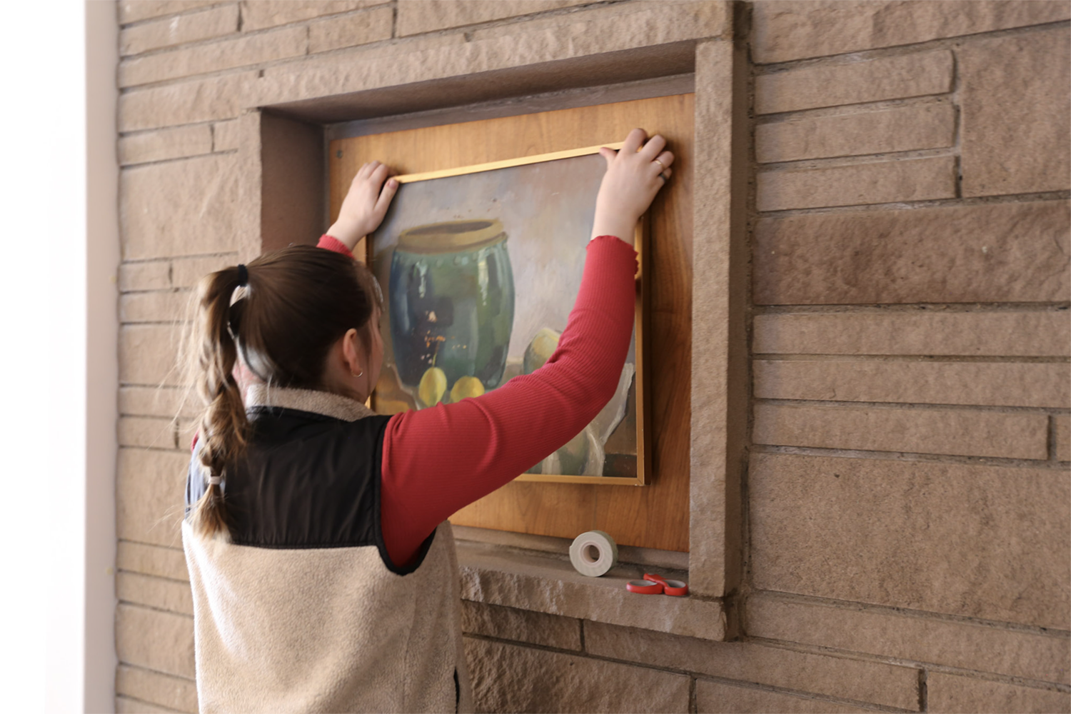 Strange Embrace BTS Hannah Greene preps the set for the filming of Strange Embrace. UAF Photo by Maya Salganek