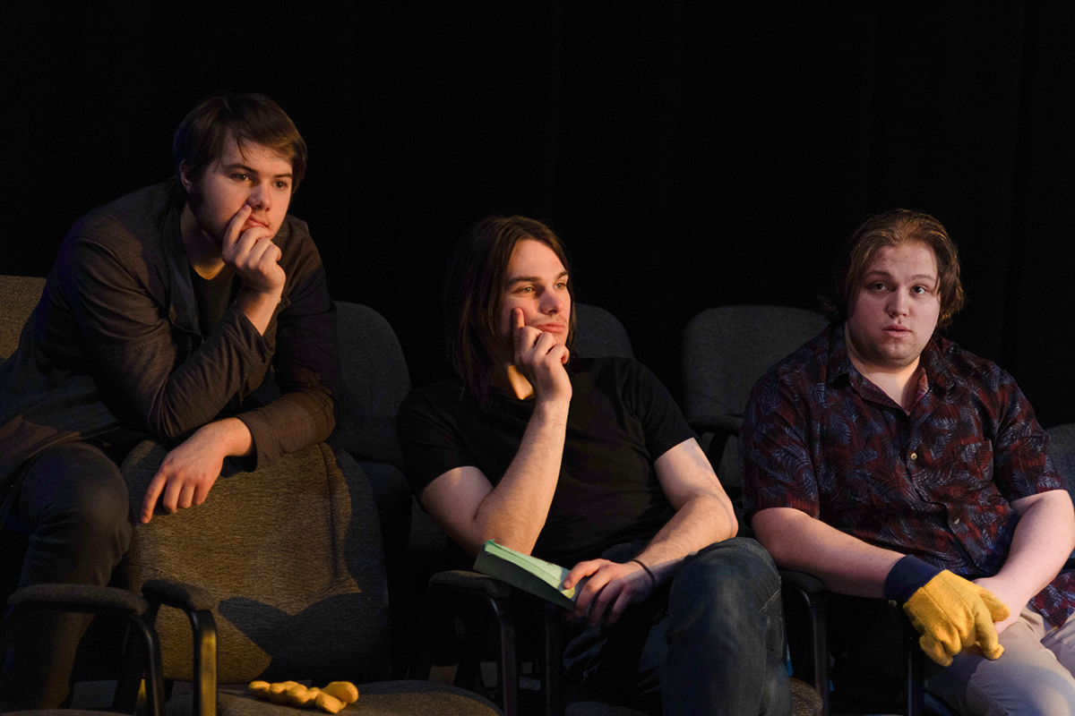 TAOS, Day 1, image 128 (left to right) Logan Ehrhart, Clark Milstead, and Graham Granger watch filming from the theatre seats. Photo credit: Eric Marshall