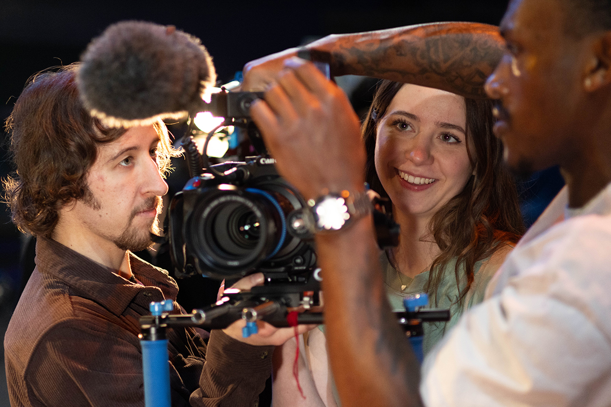 TAOS, Day 1, image 18 Chloe Miller and Dre Williams adjust the camera for filming. Photo credit: Eric Marshall
