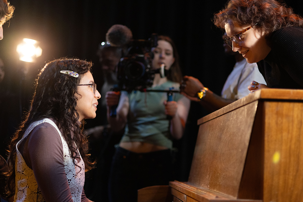 TAOS, Day 1, image 22 Taylor Kamrath provides direction to Julieth Harvey (seated at the piano). Photo credit: Eric Marshall