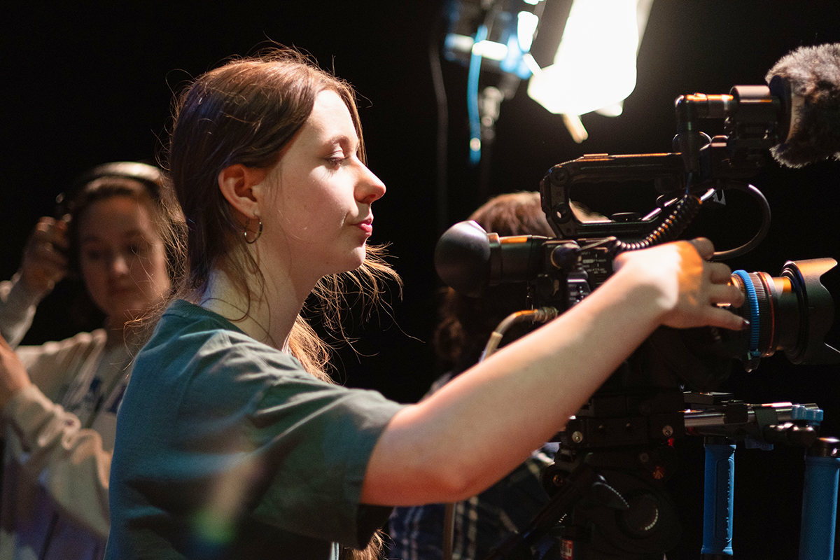 TAOS, Day 2, image 126 Chloe Miller adjusts camera settings during the filming of The Anatomy of Sound. Photo credit: Eric Marshall