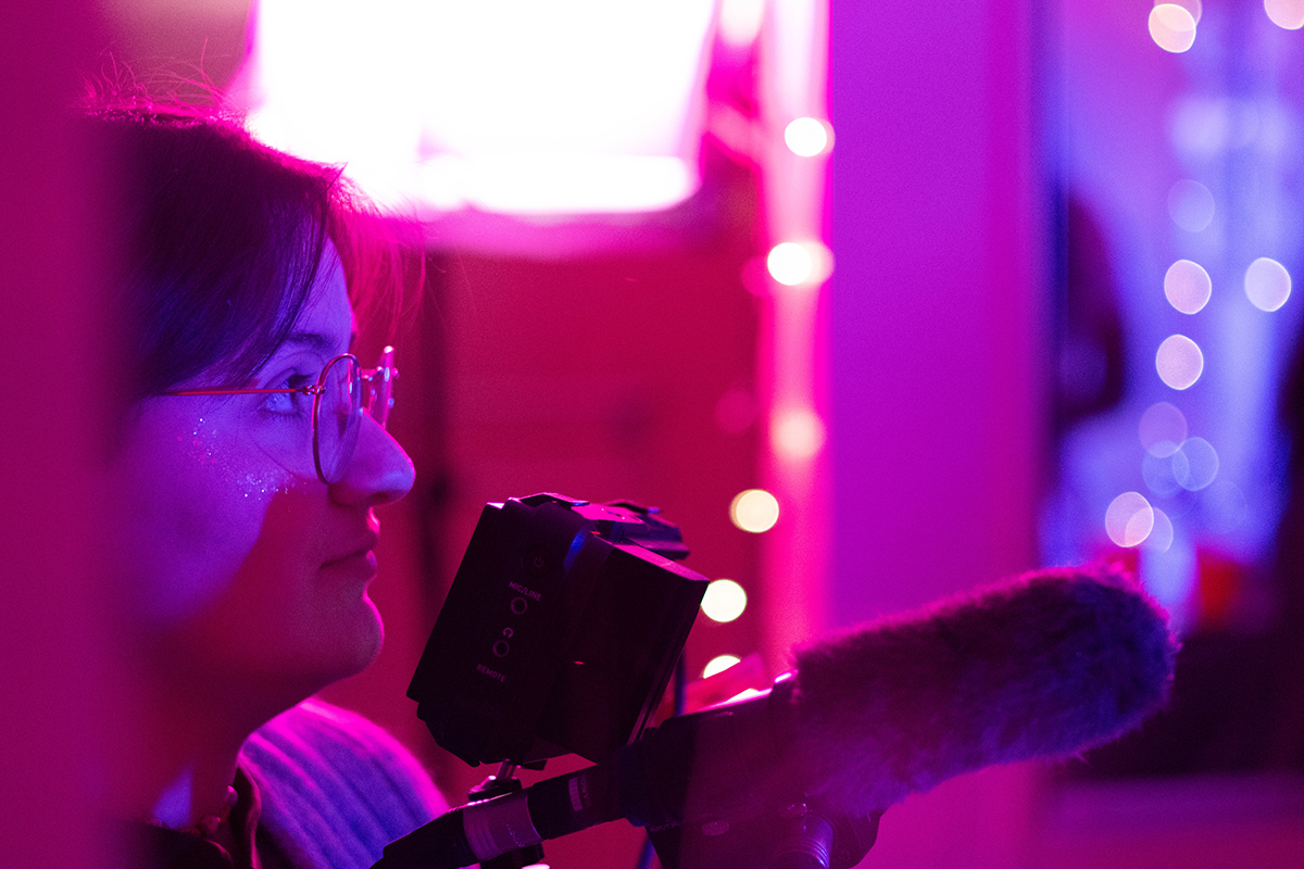 TAOS, Day 4, image 156 JB Brown looks up from the camera while filming a party scene for The Anatomy of Sound. Photo credit: Eric Marshall