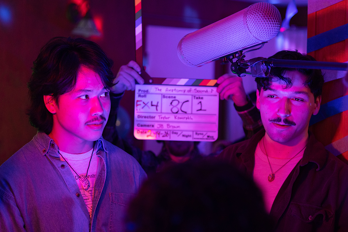 TAOS, Day 6, image 116 A clapperboard is held up behind Logan Hammersland marking the beginning of filming a party scene in The Anatomy of Sound. Photo credit: Eric Marshall