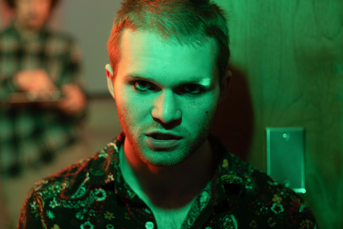 TAOS, Day 6, image 71 A straight-on shot of Jesse Schnabel under green lighting on the set of The Anatomy of Sound. Photo credit: Eric Marshall