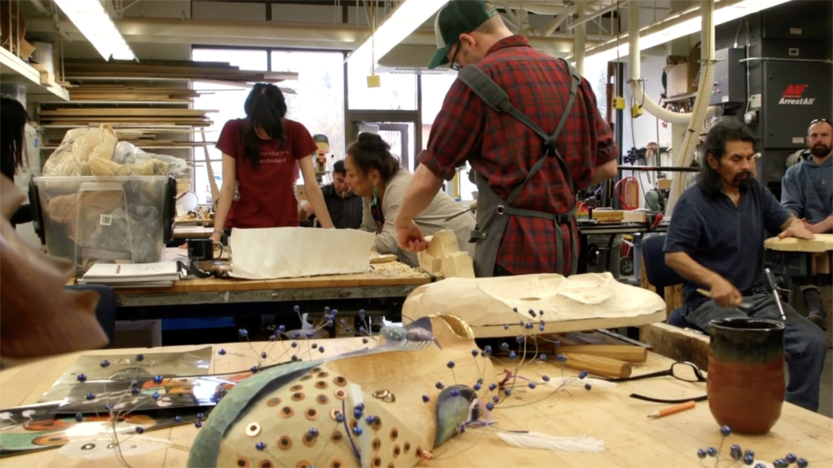 To Continue or Be Remembered A class learns to carve masks under the instruction of artist Kathleen Carlo. Still from To Continue or Be Remembered