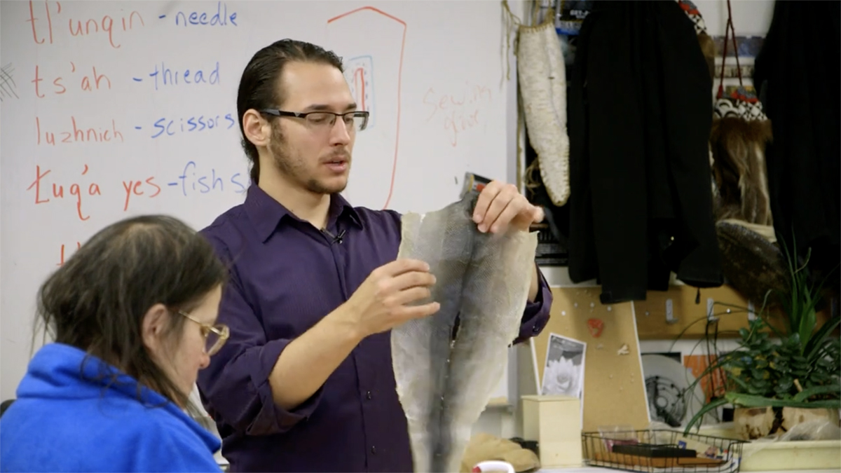 To Continue or Be Remembered Artist Joel Isaak demonstrates the use of fish skins in art. Still from To Continue or Be Remembered