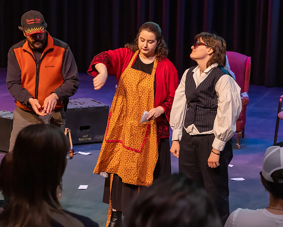 Three actors from the Student Drama Association perform onstage during SDA's 2026 Extravaganza.