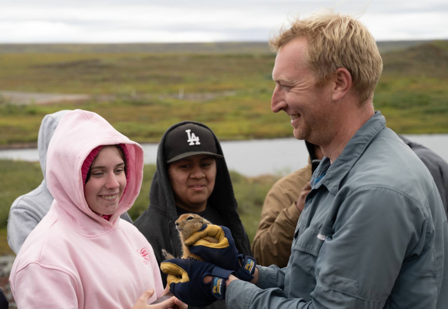 Researcher holds arctic ground squirrel to show students