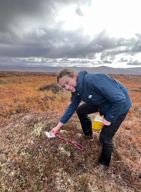 Claire Bachand standing in tundra near sampling site