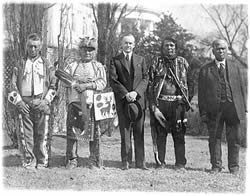 President Calvin Coolidge with four Osage Indians after Coolidge signed the bill granting Indians full citizenship