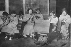  Inuit children learning to sew in a U.S. government school in Alaska, sometime between 1900-1930