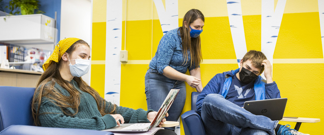 UAF students with laptops gather in the Student Support Services study lounge in Fairbanks.