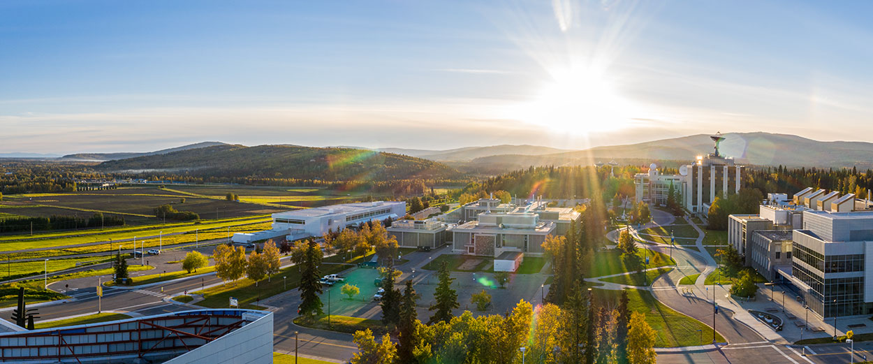 The sun sets behinds the West Ridge of the Troth Yeddha' campus in Fairbanks in autumn.