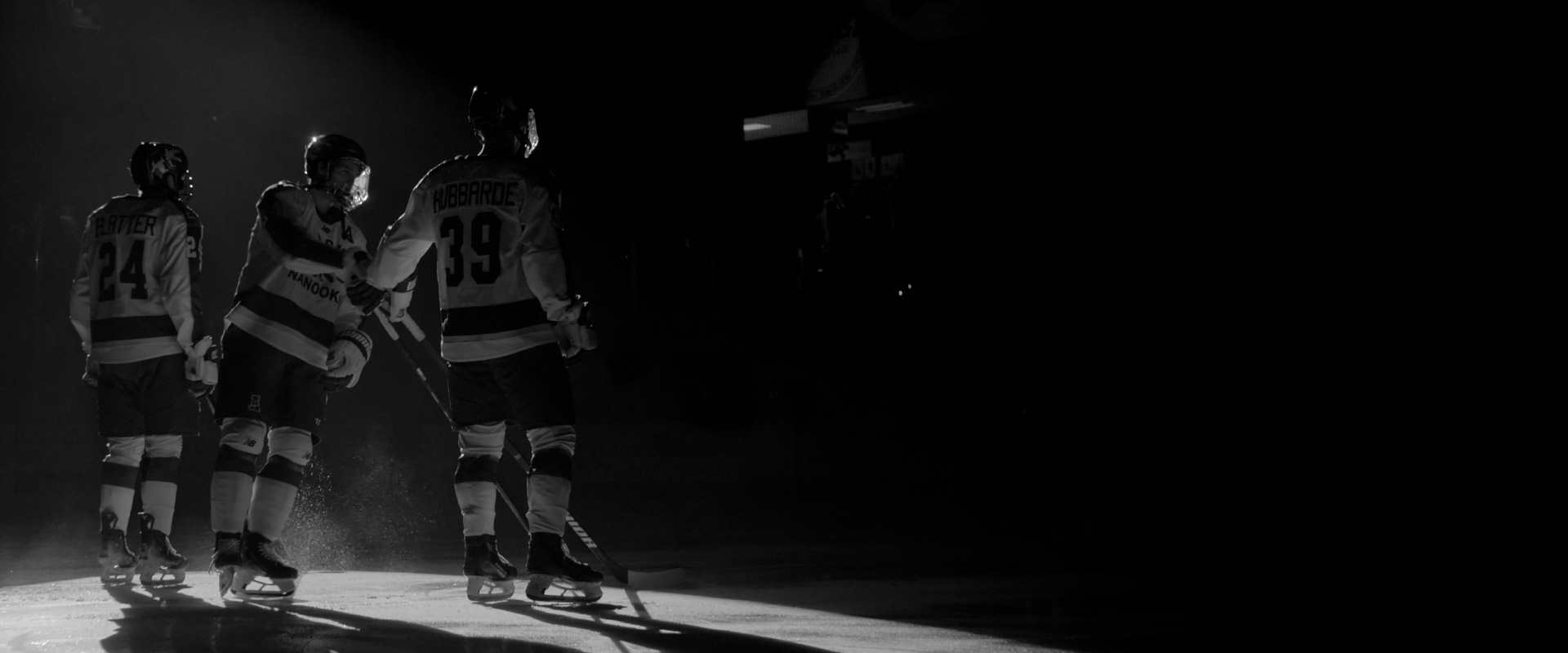 From left, Peyton Platter, Kyle Gaffney and Matt Hubbarde skate onto the ice at the Carlson Center during opening lineup introductions at a Governor’s Cup game in 2025.