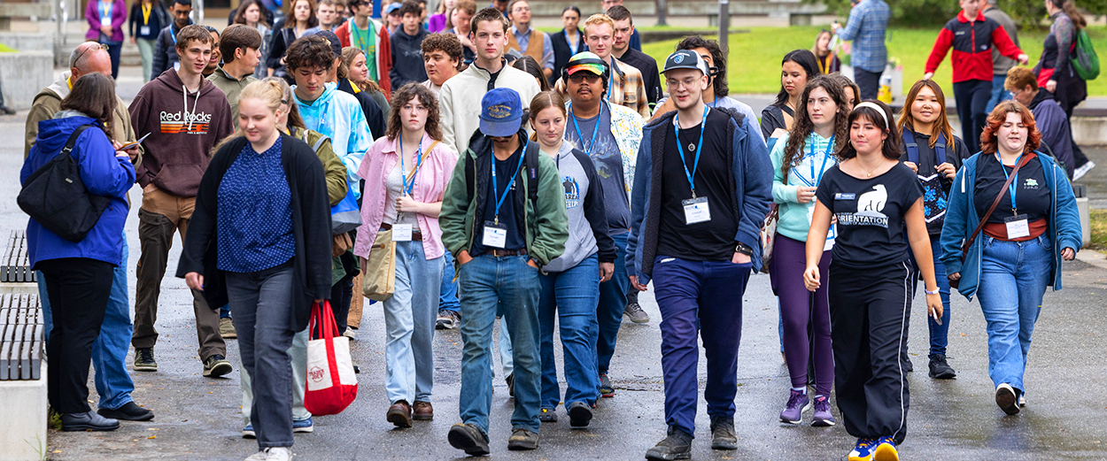 A group of students touring campus as part of new student orientation