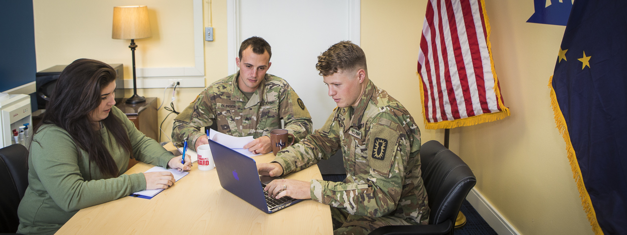 Soldiers meet with an advisor in the UAF Military and Veteran Services office