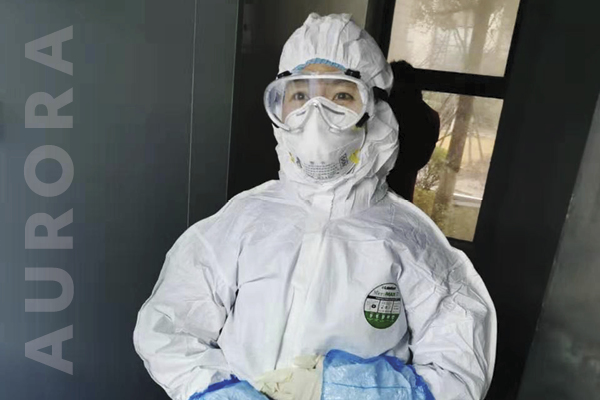 Qian Li, alumni 12, wears personal protective equipment while working in Wuhan, China