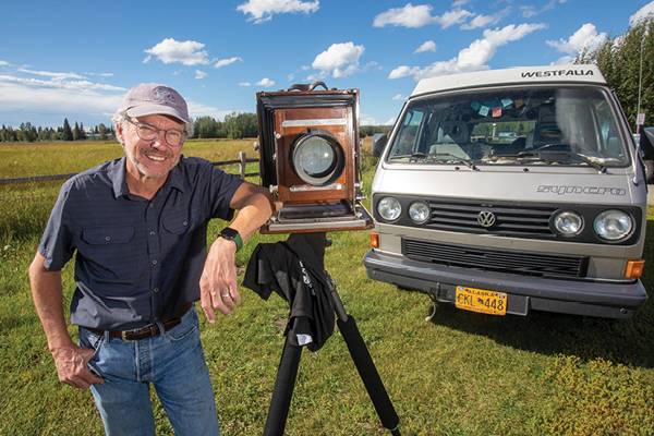 Charles Mason stands with his 8-by-10 camera and VW Syncro Westfalia Vanagon at Creamer’s Field in Fairbanks