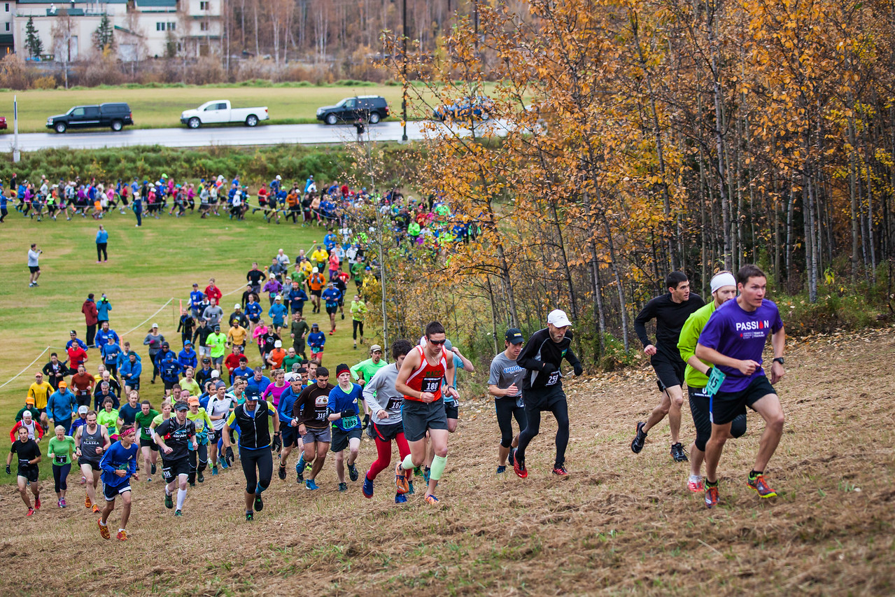 Equinox marathon participants run up the hill at the start of the race on the UAF campus