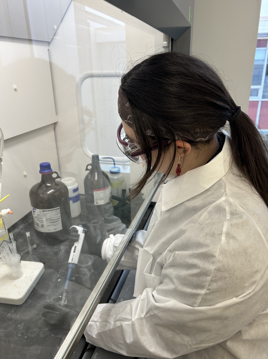 Remy pipetting chemicals in the lab