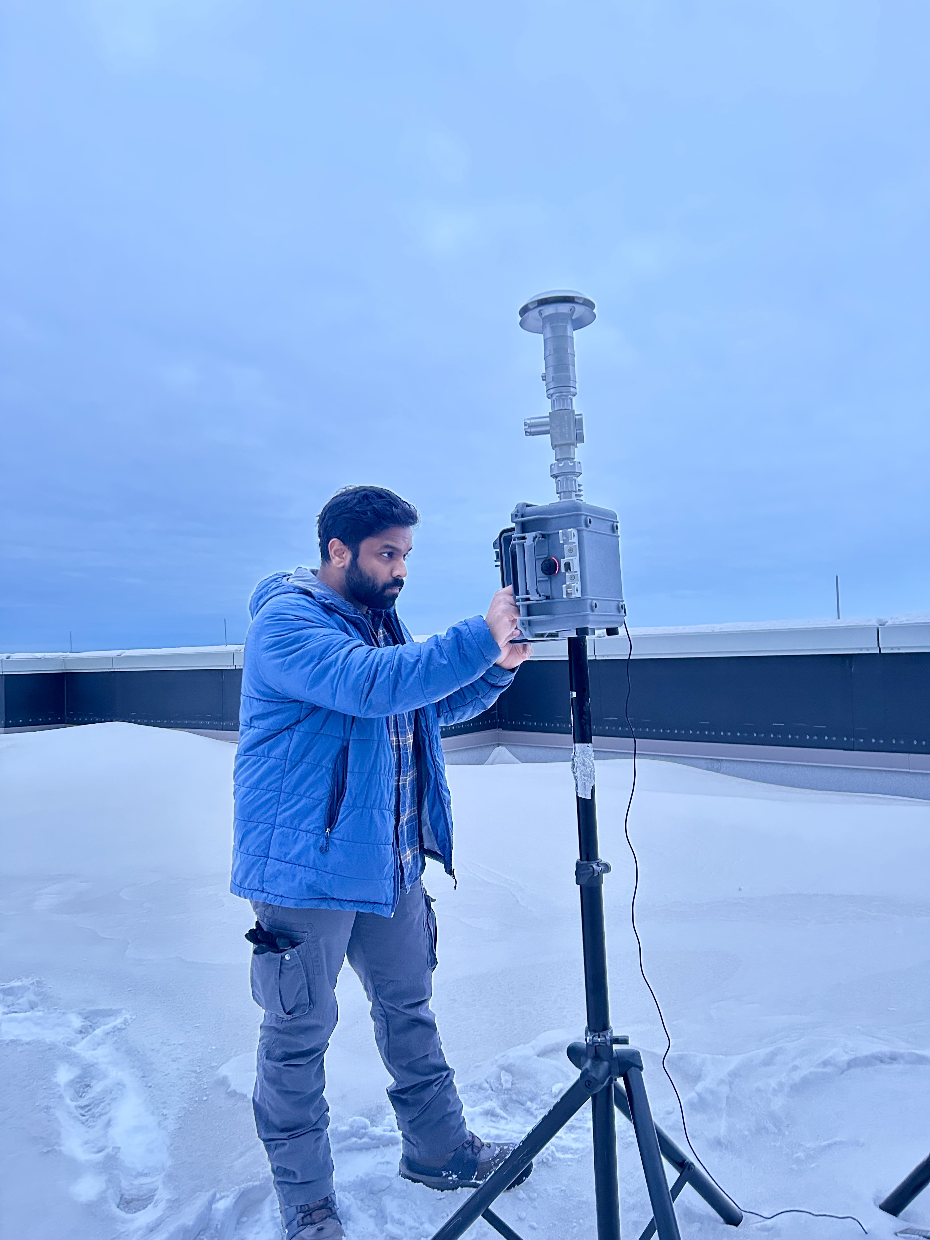 Jenno collecting PM2.5 samples on the ELIF roof (Courtesy of Jenno J.L.H.).