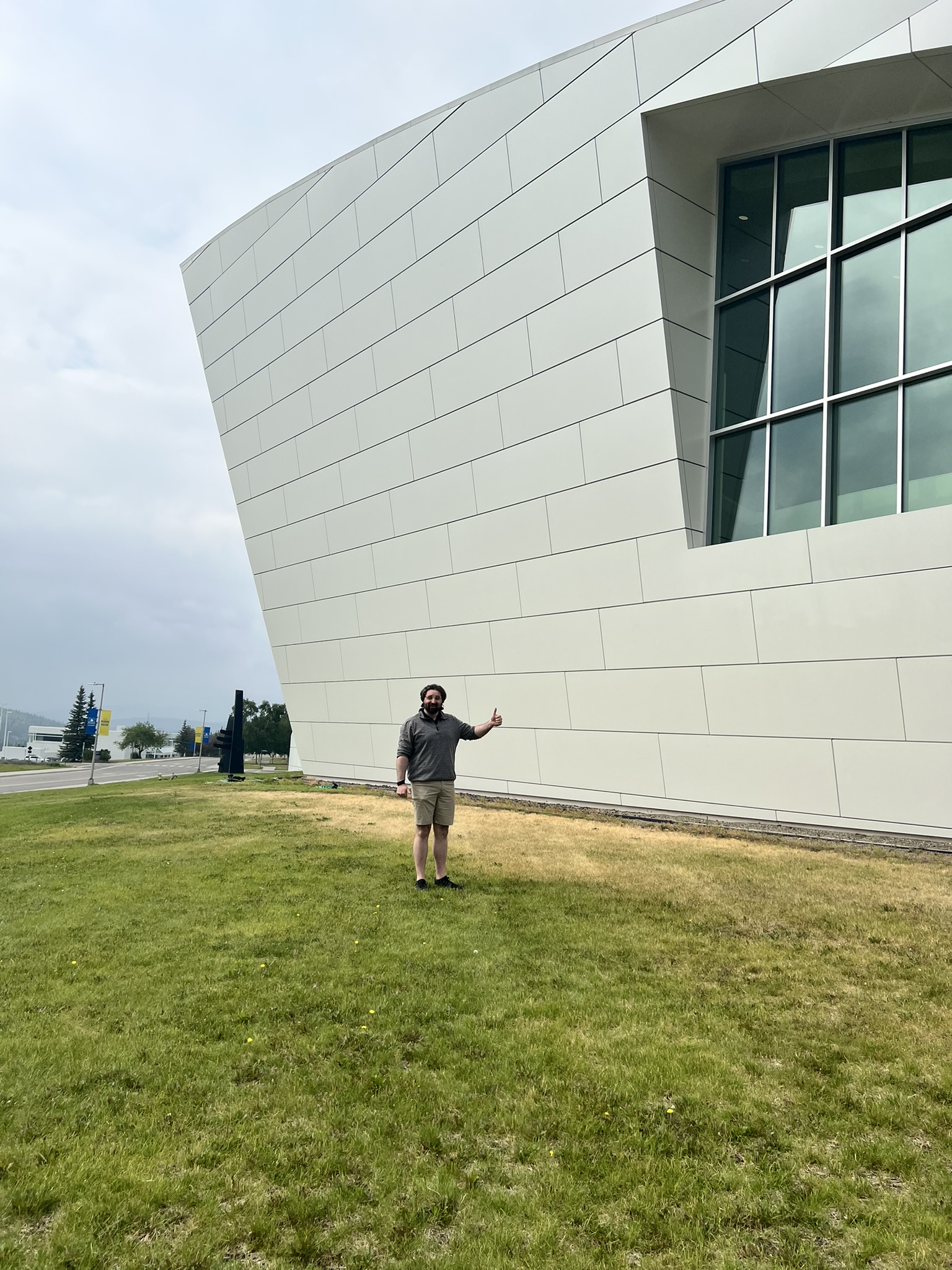 Starkey standing in front of the museum building