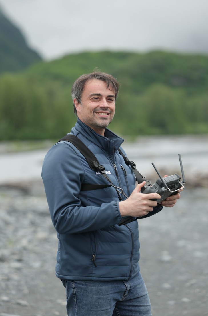 Alex operating a drone outside. 