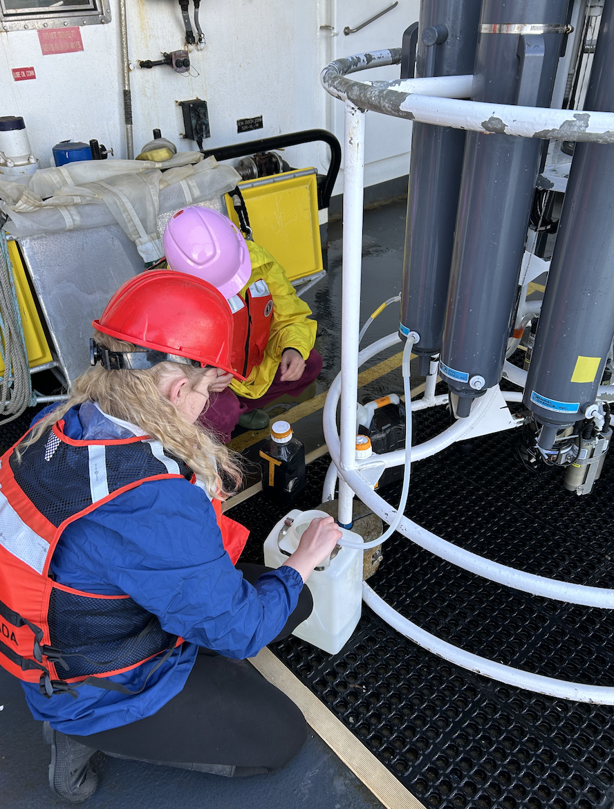 Hannah Miller, Summer 2024 Awardee, with a CalCoFi team member collecting water samples off the coast of San Diego, California.